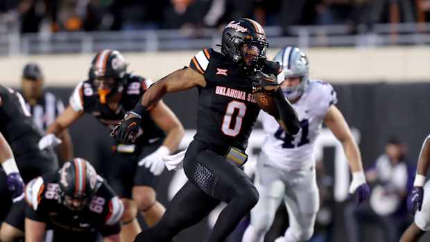 Oklahoma State's Ollie Gordon II (0) runs the ball in the first half of the college football game between the Oklahoma State University Cowboys and the Kansas State Wildcats at Boone Pickens Stadium in Stillwater. Okla., Friday, Oct. 6, 2023. OSU won 29-21.  